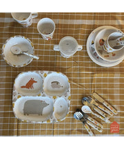 Maison Petit Jour Aventure 4-Compartment Feeding Plate – four-compartment plate on a table