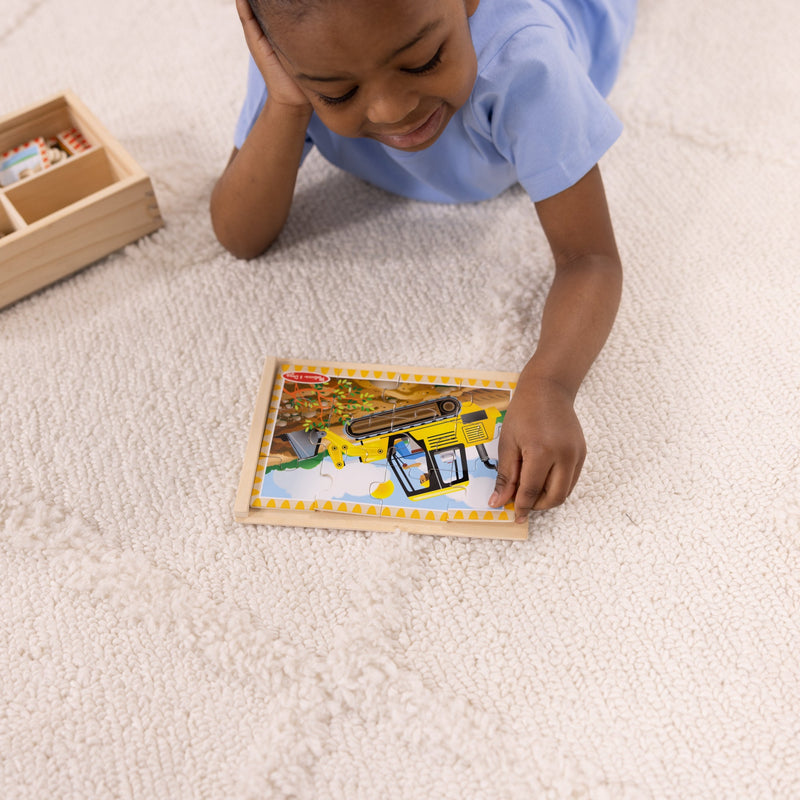 Melissa & Doug - 12-Piece Wooden Puzzles - Construction Vehicles (Set of 4) - in use during play