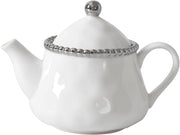 White teapot with silver decorative rim on a white background