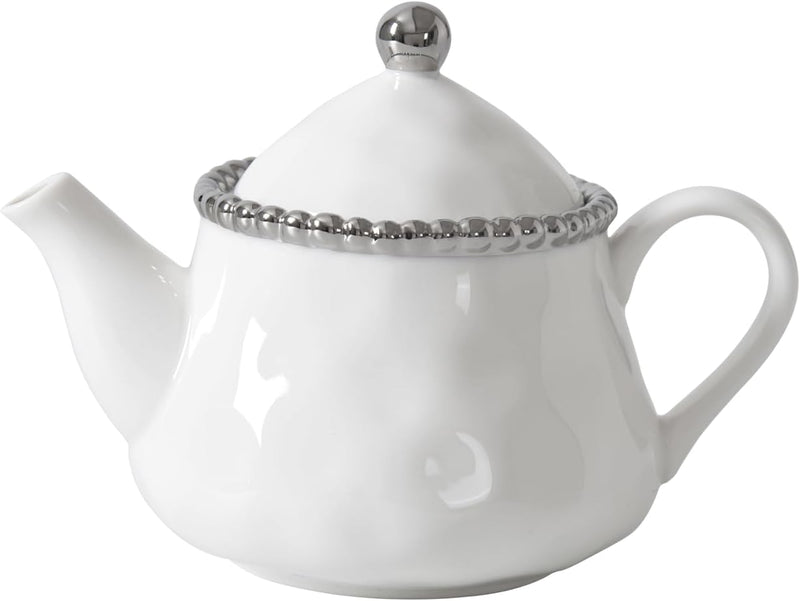 White teapot with silver decorative rim on a white background