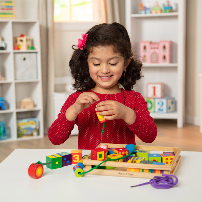 Melissa & Doug - Lacing Beads - in use during play