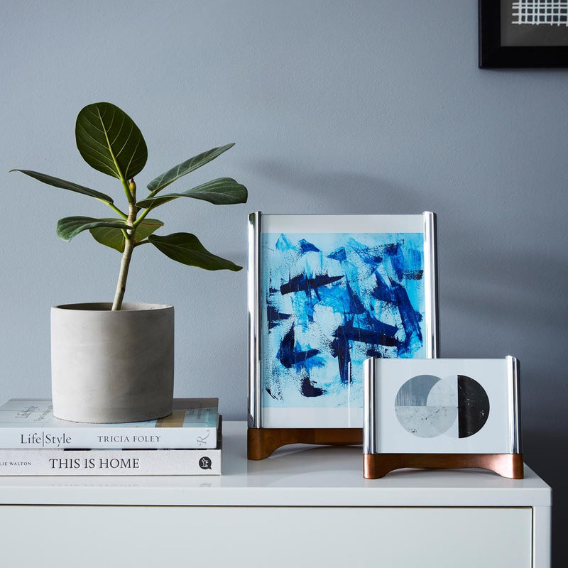 Nambé Sky View Photo Frame in a display setting; other items shown are sold separately.