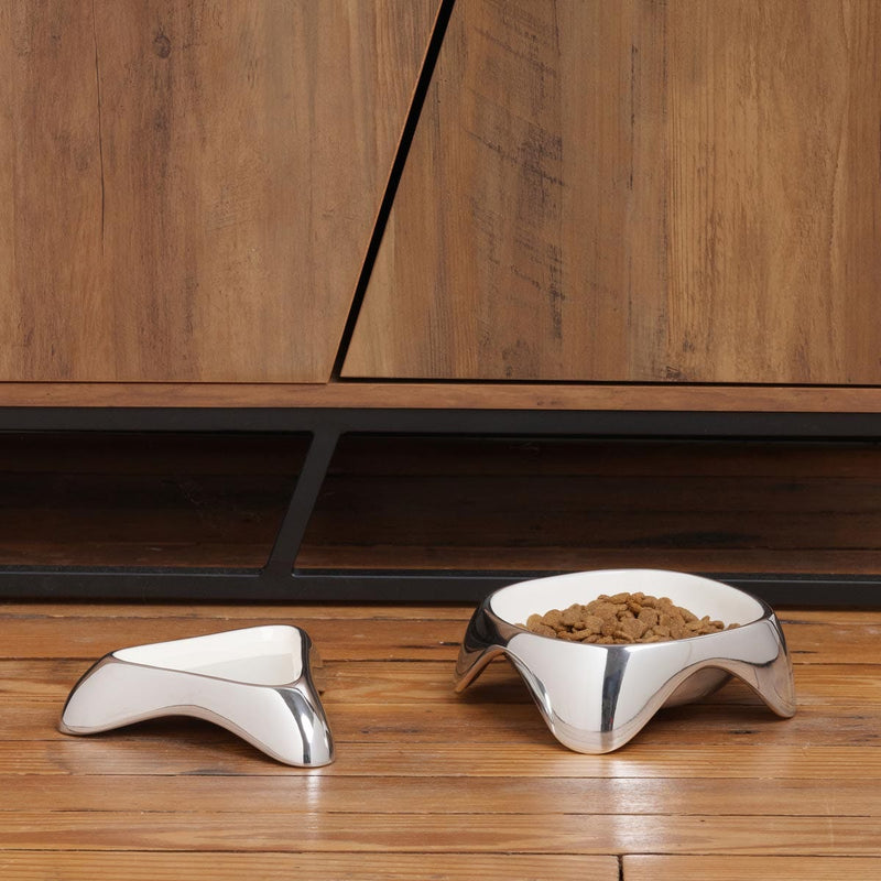 Nambé Pet Bowl - Small in a display setting; other items shown are sold separately.