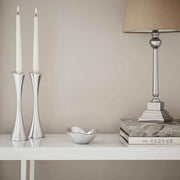 Nambé Aquila Candleholders, Set of 2 in a display setting; other items shown are sold separately.