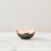 Nambé Copper Canyon Bowl in a display setting; other items shown are sold separately.