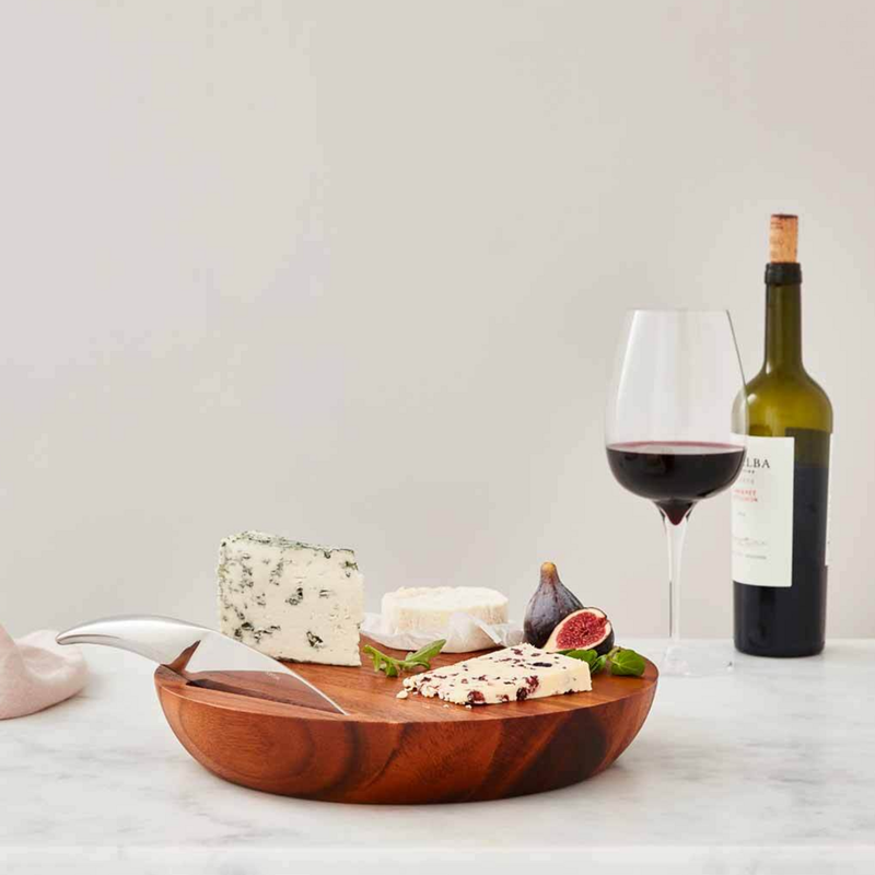 Nambé Harmony Cheese Board with Knife in a display setting; other items shown are sold separately.