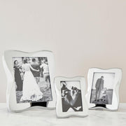 Nambé Bella Photo Frame in a display setting; other items shown are sold separately.