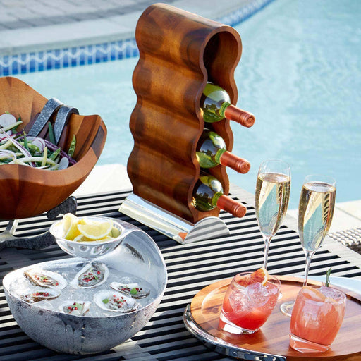 Nambé Curvo Wine Rack in a display setting; other items shown are sold separately.