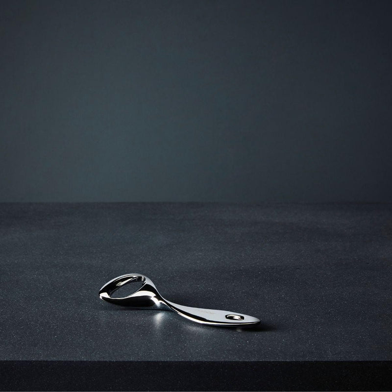 Nambé Twist Bottle Opener in a display setting; other items shown are sold separately.