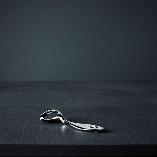 Nambé Twist Bottle Opener in a display setting; other items shown are sold separately.