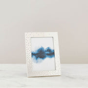 Nambé Dazzle Photo Frame in a display setting; other items shown are sold separately.