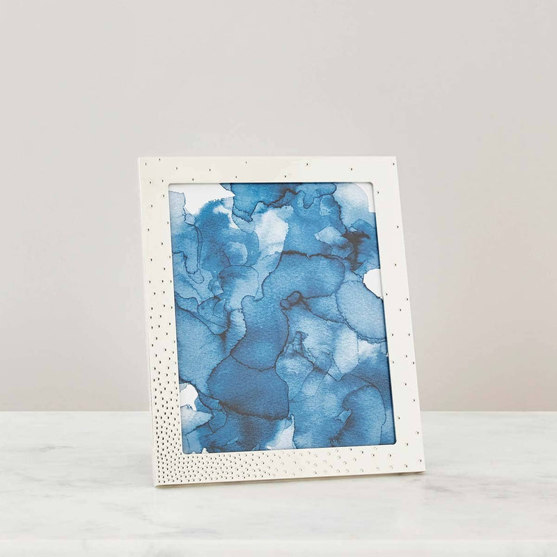 Nambé Dazzle Photo Frame in a display setting; other items shown are sold separately.