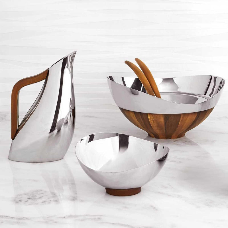 Nambé Pulse Pitcher in a display setting; other items shown are sold separately.