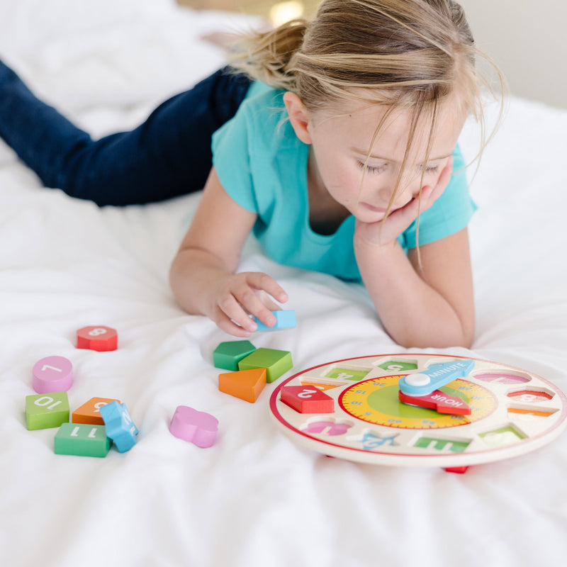 Melissa & Doug - Shape Sorting Clock - in use during play