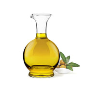 Natural Living - Glass Oil Cruet — oil cruet filled with oil.