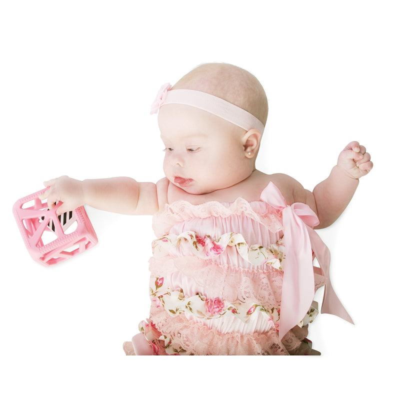Malarkey Kids Chew Cube Teething Rattle – Pink – baby exploring pink cube