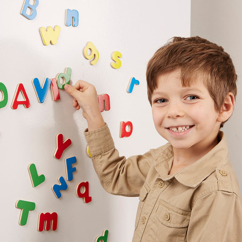 Melissa & Doug - Wooden Letter Alphabet Magnets - in use during play