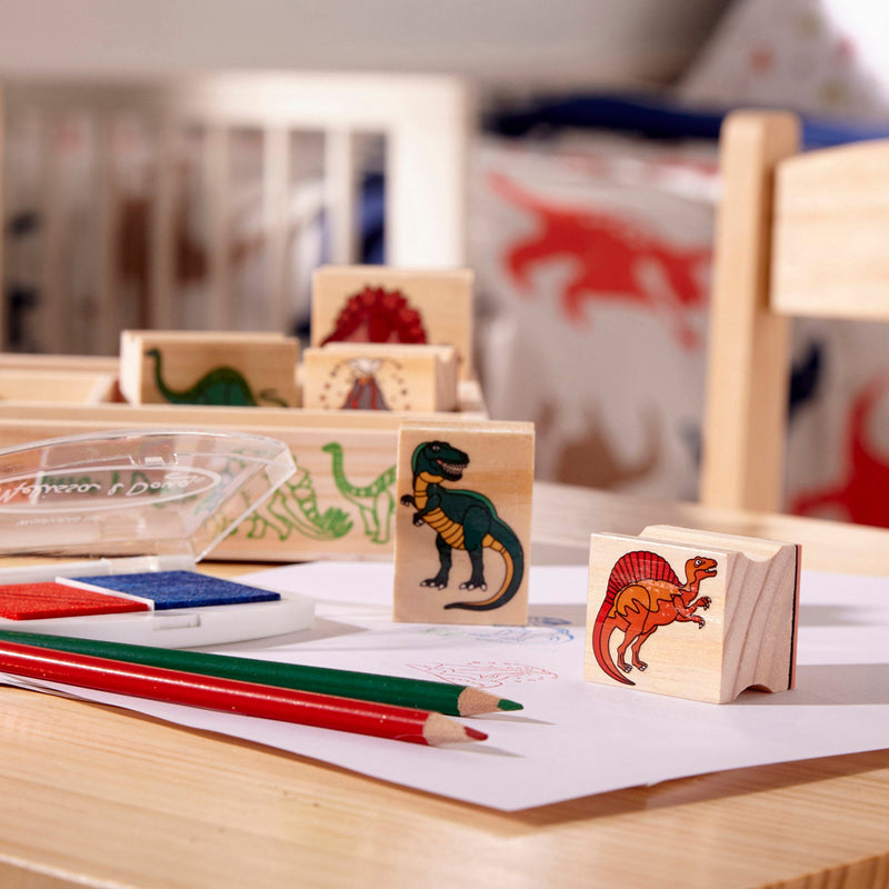 Melissa & Doug - Wooden Stamp Set - Dinosaurs - in use during play