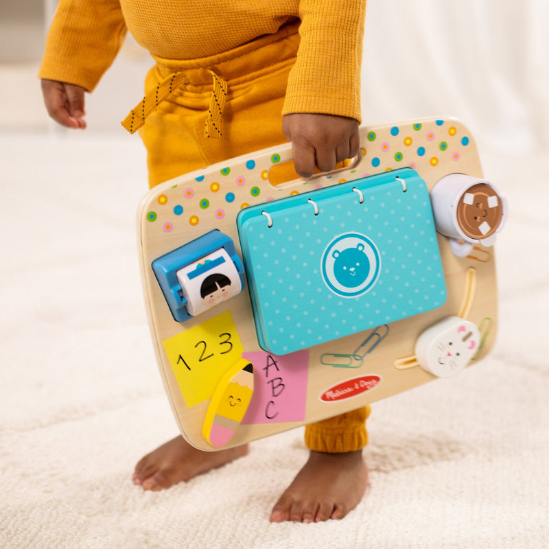 Melissa & Doug - Wooden Work & Play Desktop Activity Board - carrying the desktop activity board