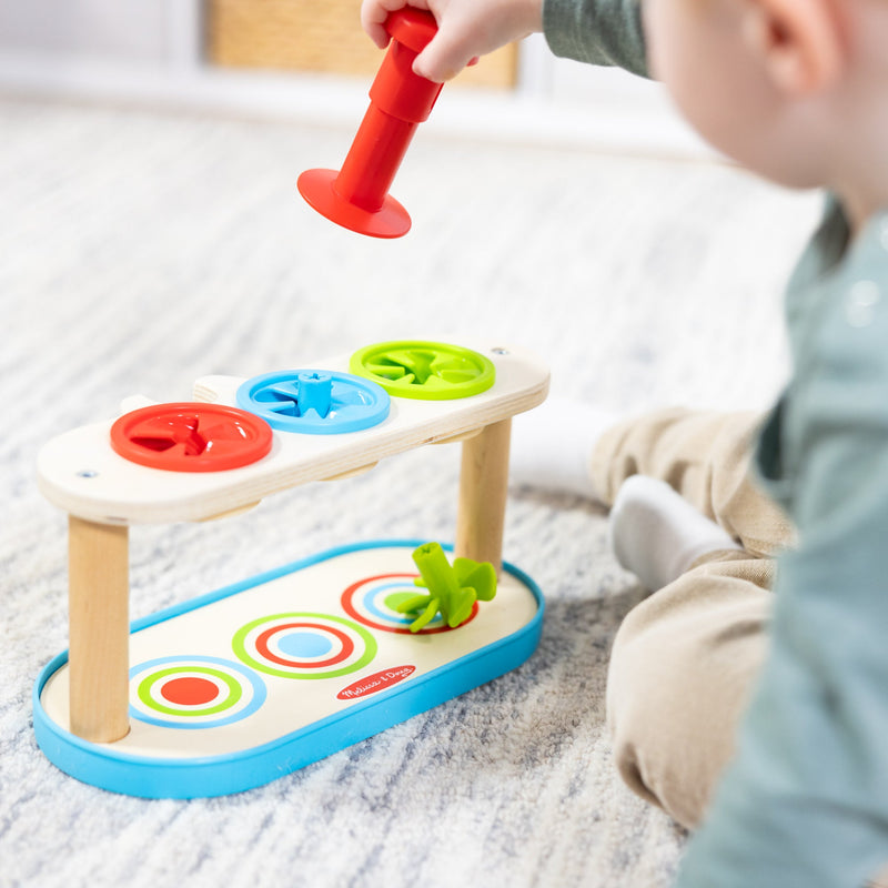 Melissa & Doug - Match & Push Spinning Tops - in use during play