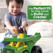 MEGA BLOKS John Deere Dump Truck Building Set (DBL30) — child building with truck