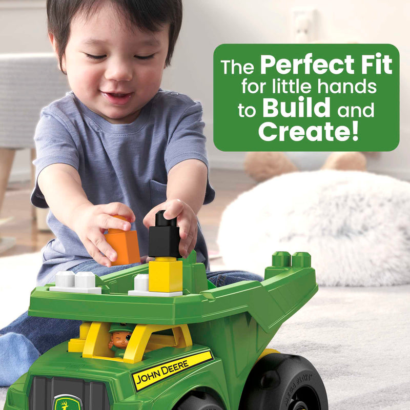 MEGA BLOKS John Deere Dump Truck Building Set (DBL30) — child building with truck