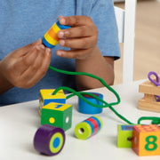 Melissa & Doug - Lacing Beads - in use during play