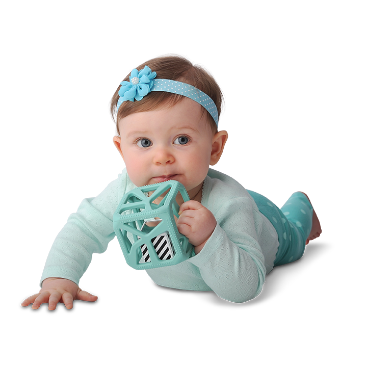 Malarkey Kids Chew Cube Teething Rattle – Mint Green – baby exploring mint green cube during tummy time