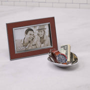 Nambé Novara Photo Frame in a display setting; other items shown are sold separately.