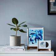 Nambé Sky View Photo Frame in a display setting; other items shown are sold separately.